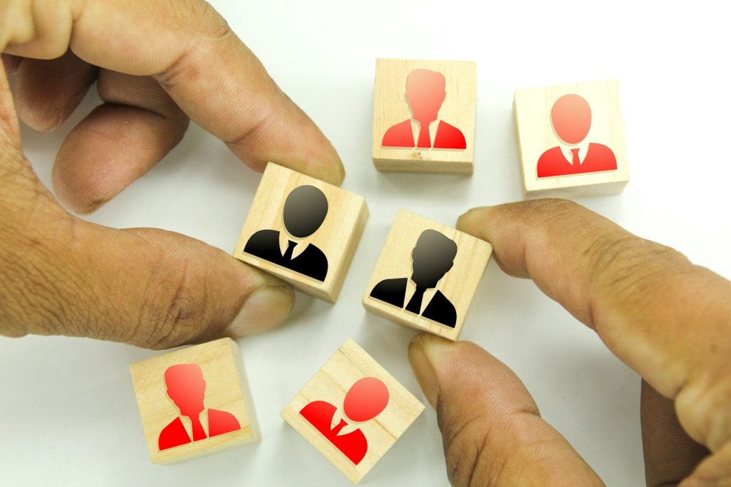 Employees icon on wooden cubes with single red color