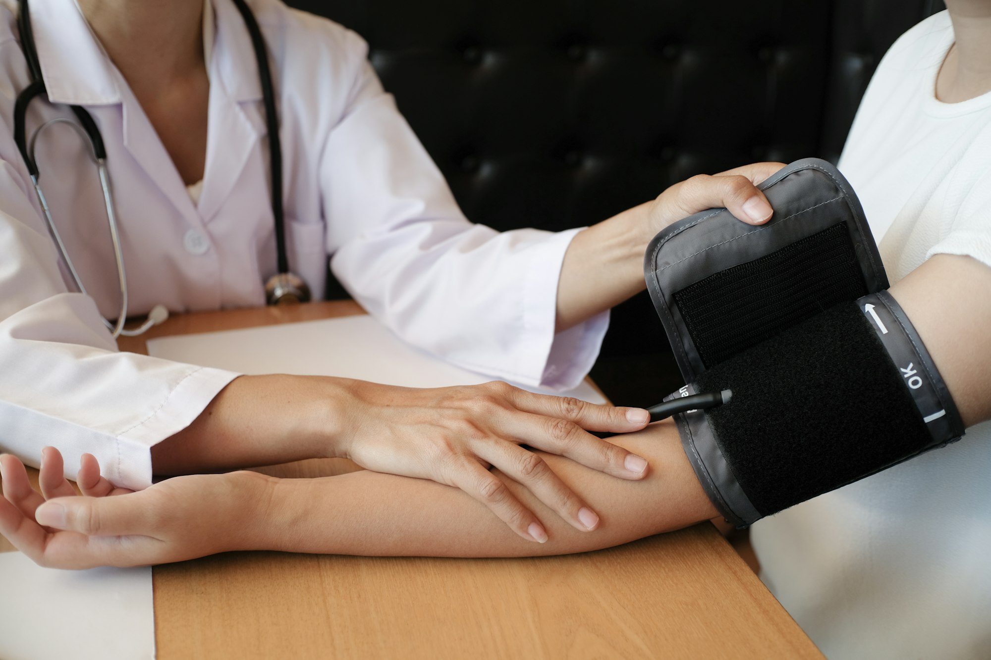 Doctor checking patient arterial blood pressure. Health care