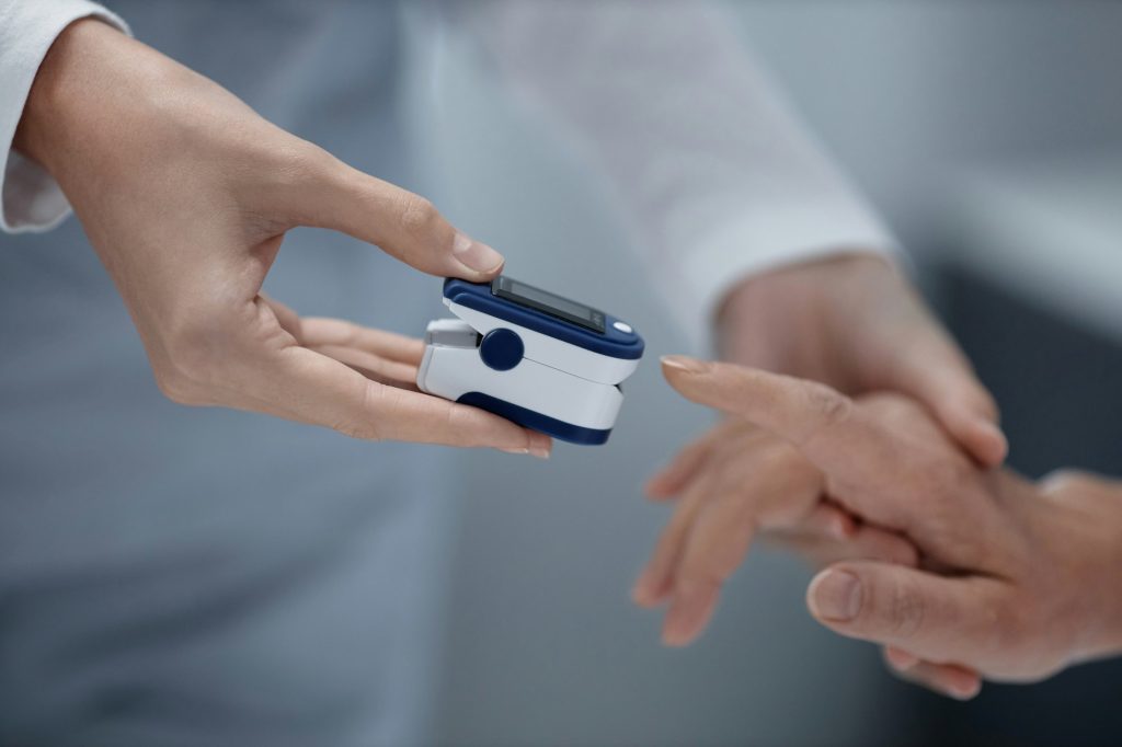 Doctor examining blood pressure of patient